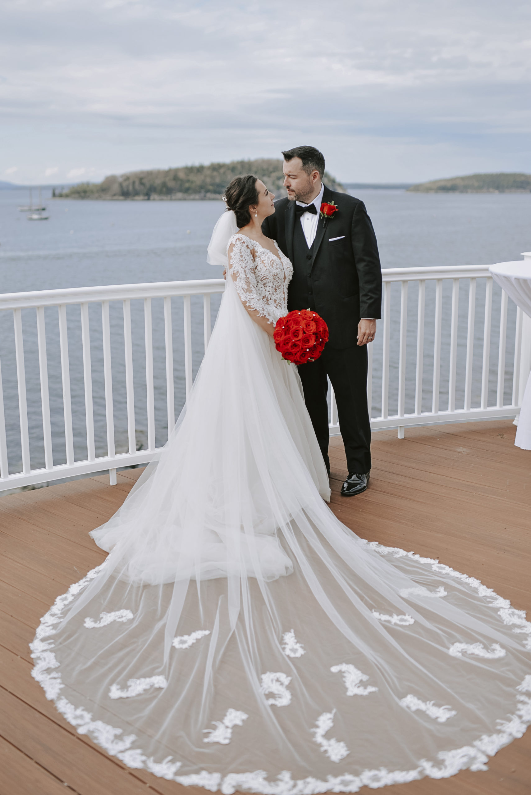Photo of a bride and groom on the deck of the Porcupine Room at the Bar Harbor Inn