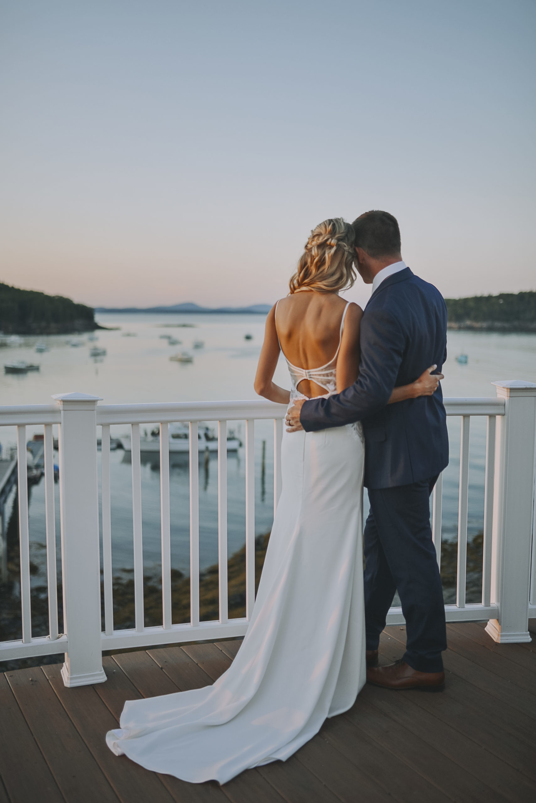 Photo of a bride and groom on the deck of the Porcupine Room at the Bar Harbor Inn