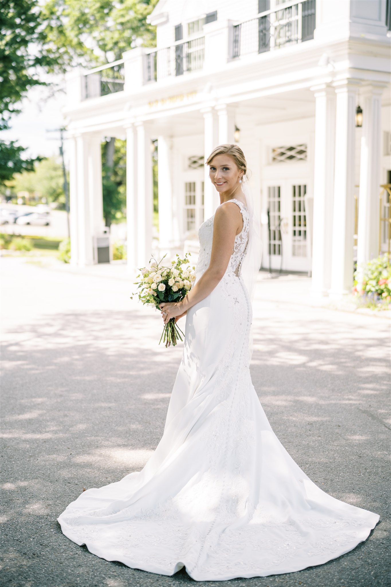 Photo of a bride in front of the Bar Harbor Inn entrance
